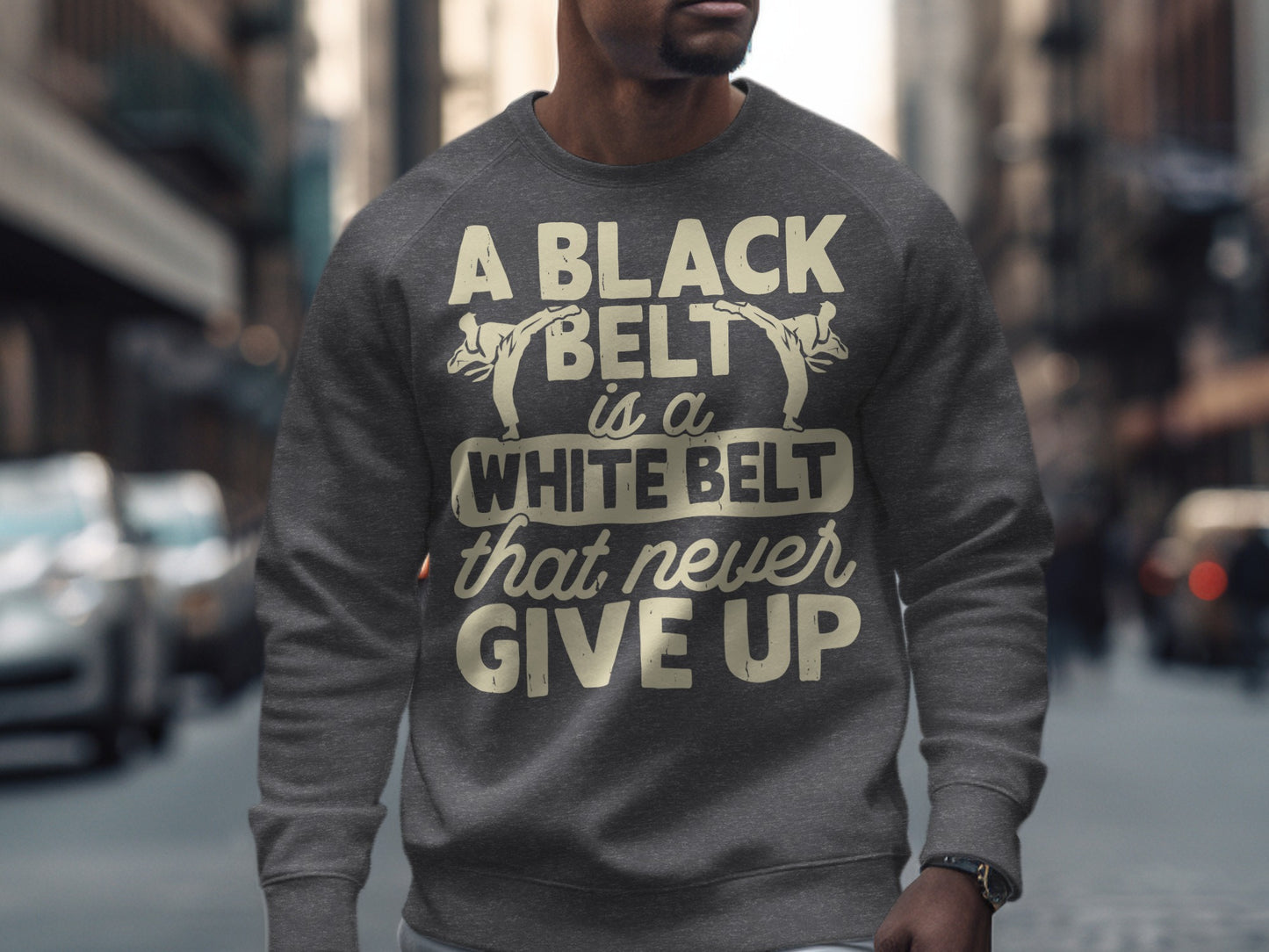 Grey sweatshirt with "A black belt is a white belt that never give up" text.