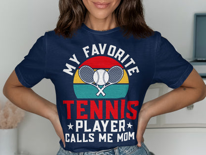 Navy t-shirt with "My Favorite Tennis Player Calls Mom" and crossed racquets graphic.