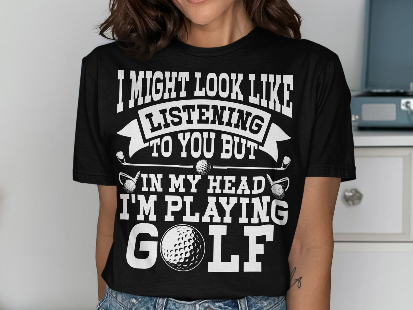 Black t-shirt with white text and golf imagery, saying "I'm playing golf".