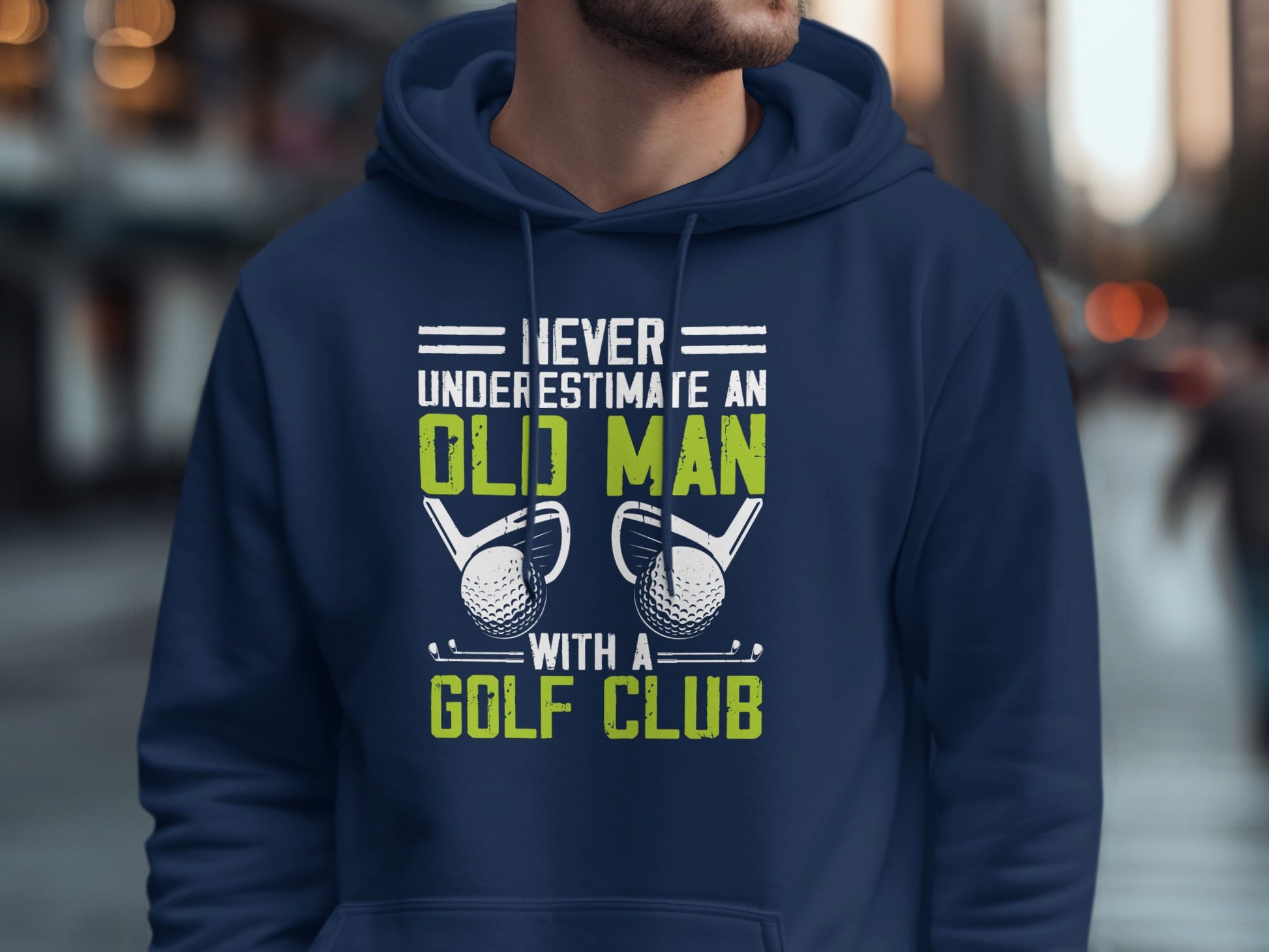 Navy hoodie with "Never underestimate an old man with a golf club" text and golf clubs.