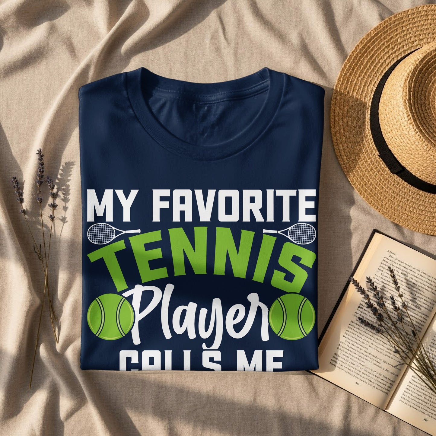 Navy t-shirt with "MY FAVORITE TENNIS PLAYER CALLS ME" text and graphics.
