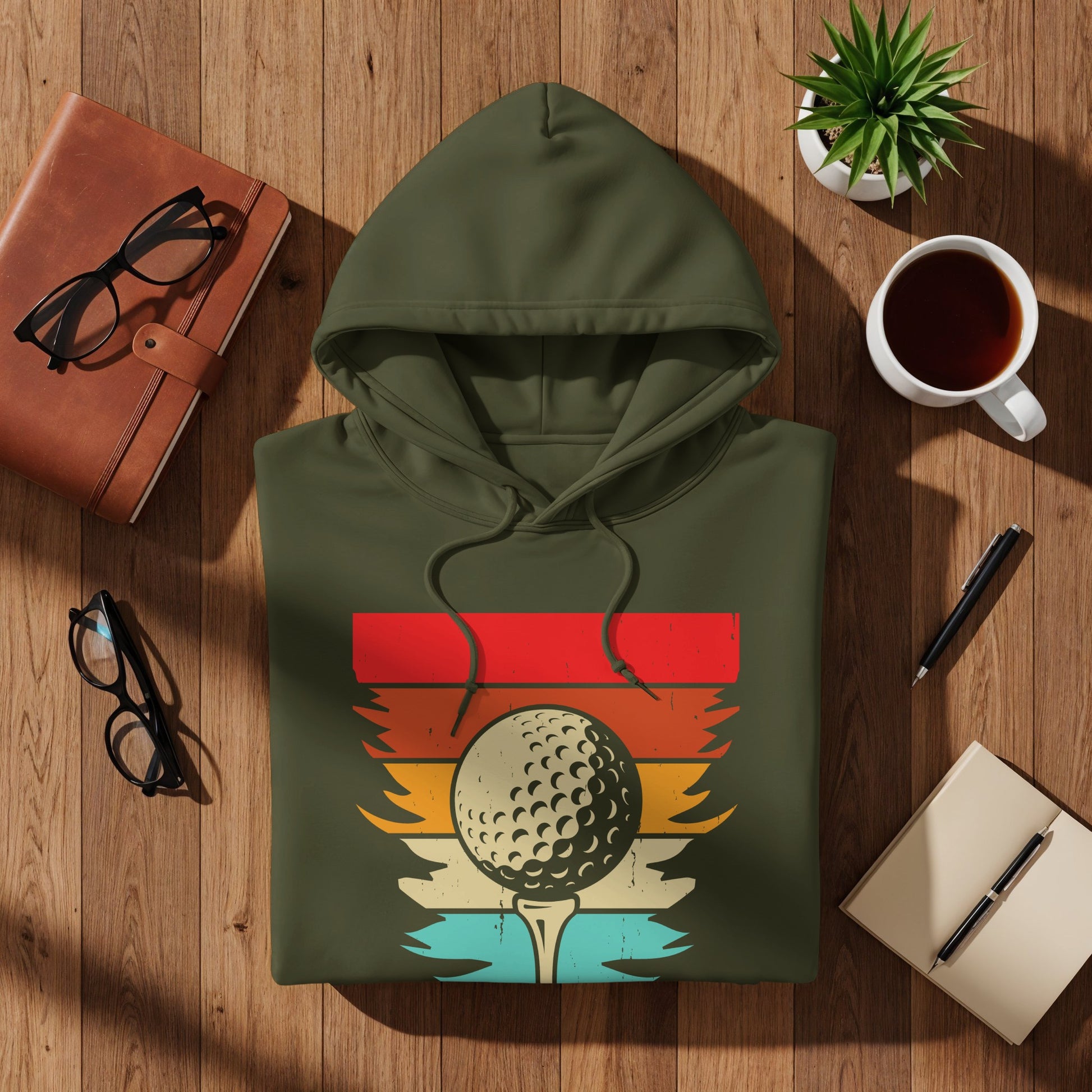 Olive green hoodie with a vintage golf ball on a tee graphic.