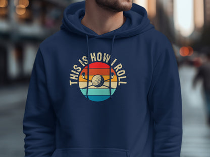 Navy hoodie with "This is How I Roll" and golf balls with clubs graphic.