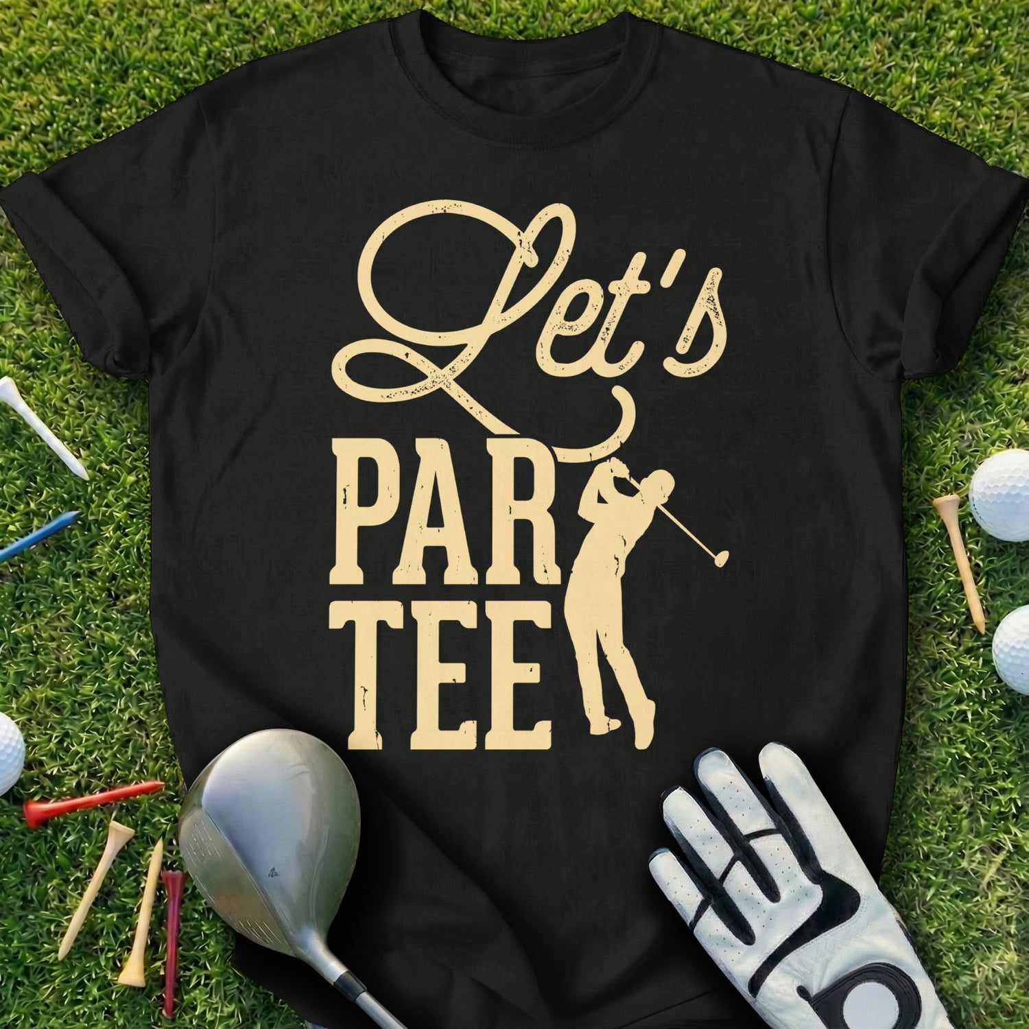 Black t-shirt with "Let's Par Tee" text and golfer graphic on grass.