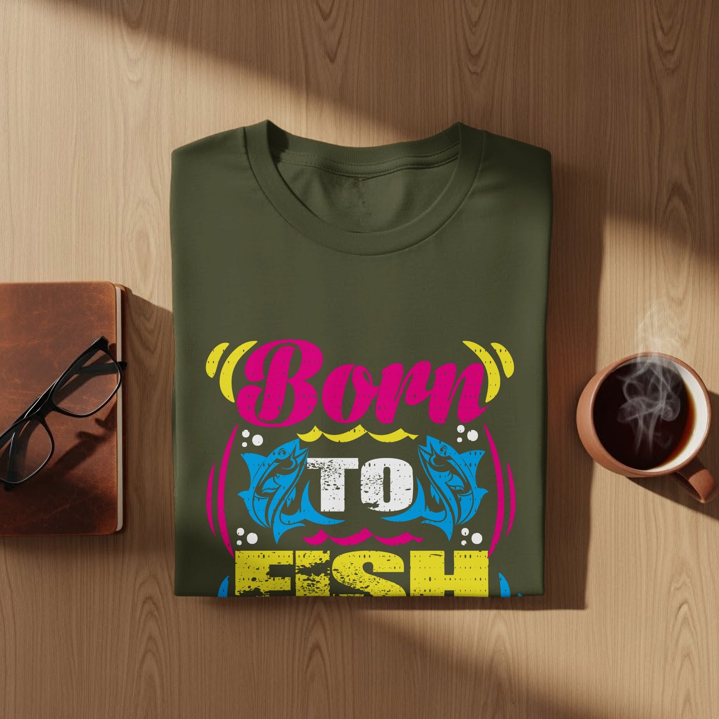 Green t-shirt with "Born To Fish" text and fish graphic.
