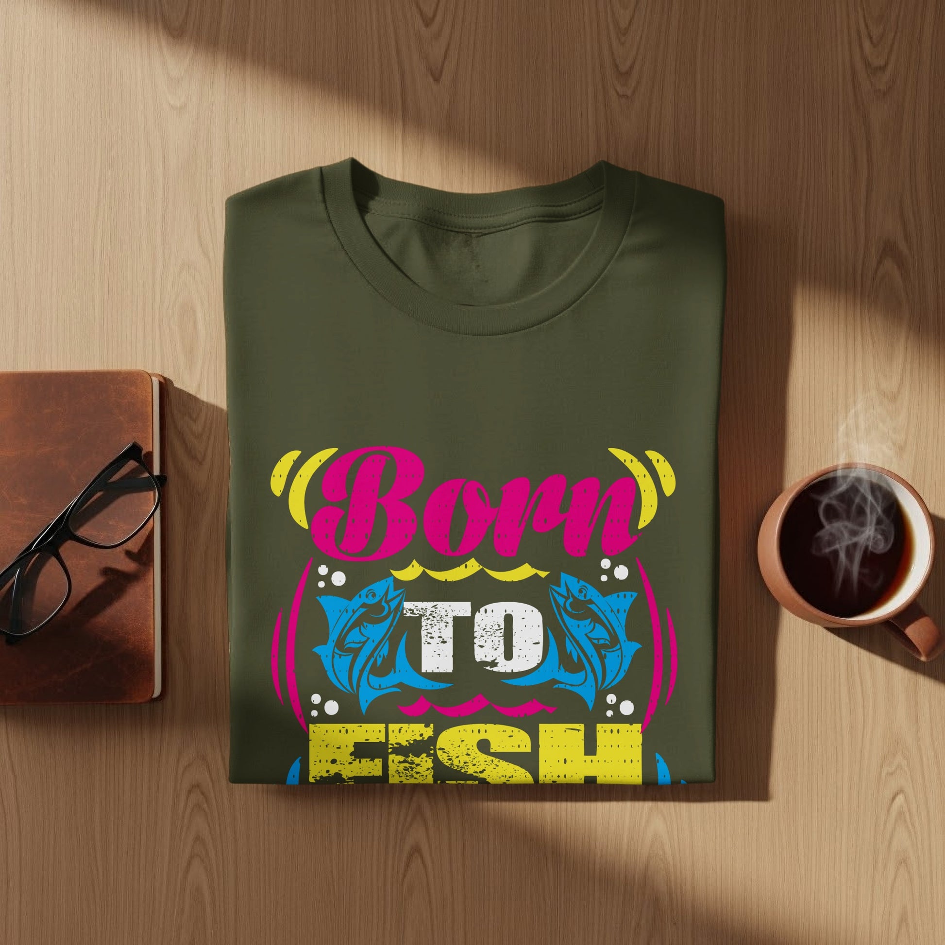 Green t-shirt with "Born To Fish" text and fish graphic.