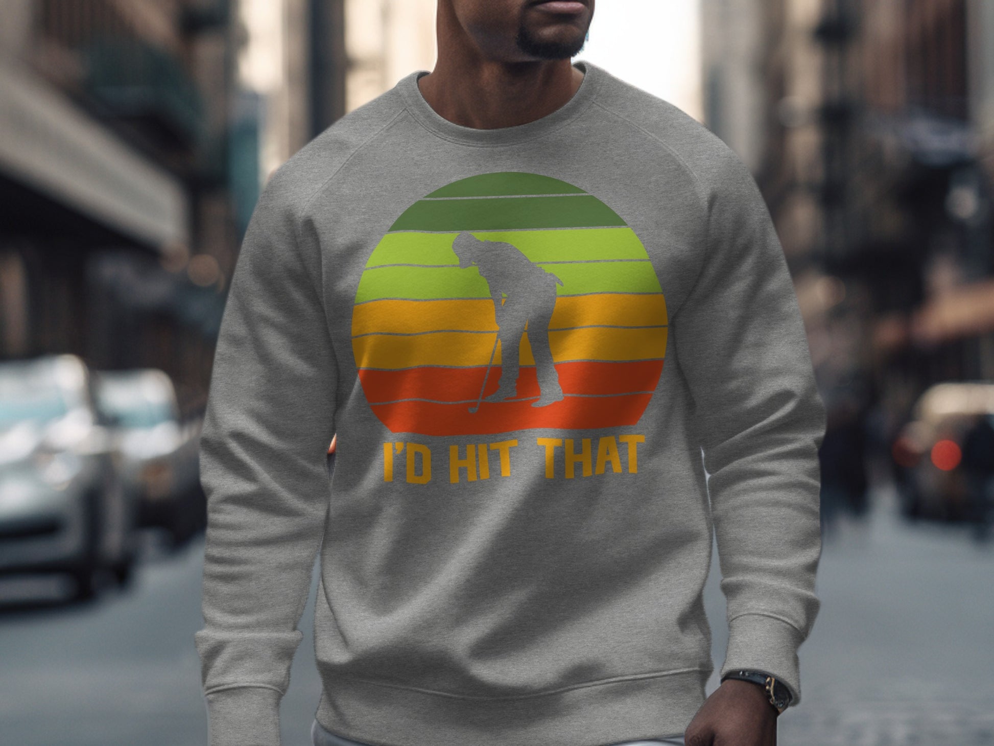 Gray sweatshirt with a golfer silhouette over a retro sunset graphic.