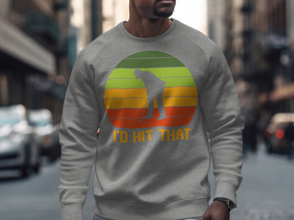Gray sweatshirt with a golfer silhouette over a retro sunset graphic.