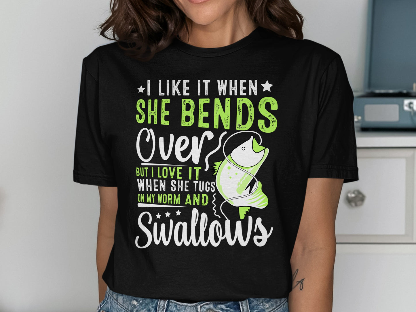 T-shirt with green fish graphic and text about fishing.