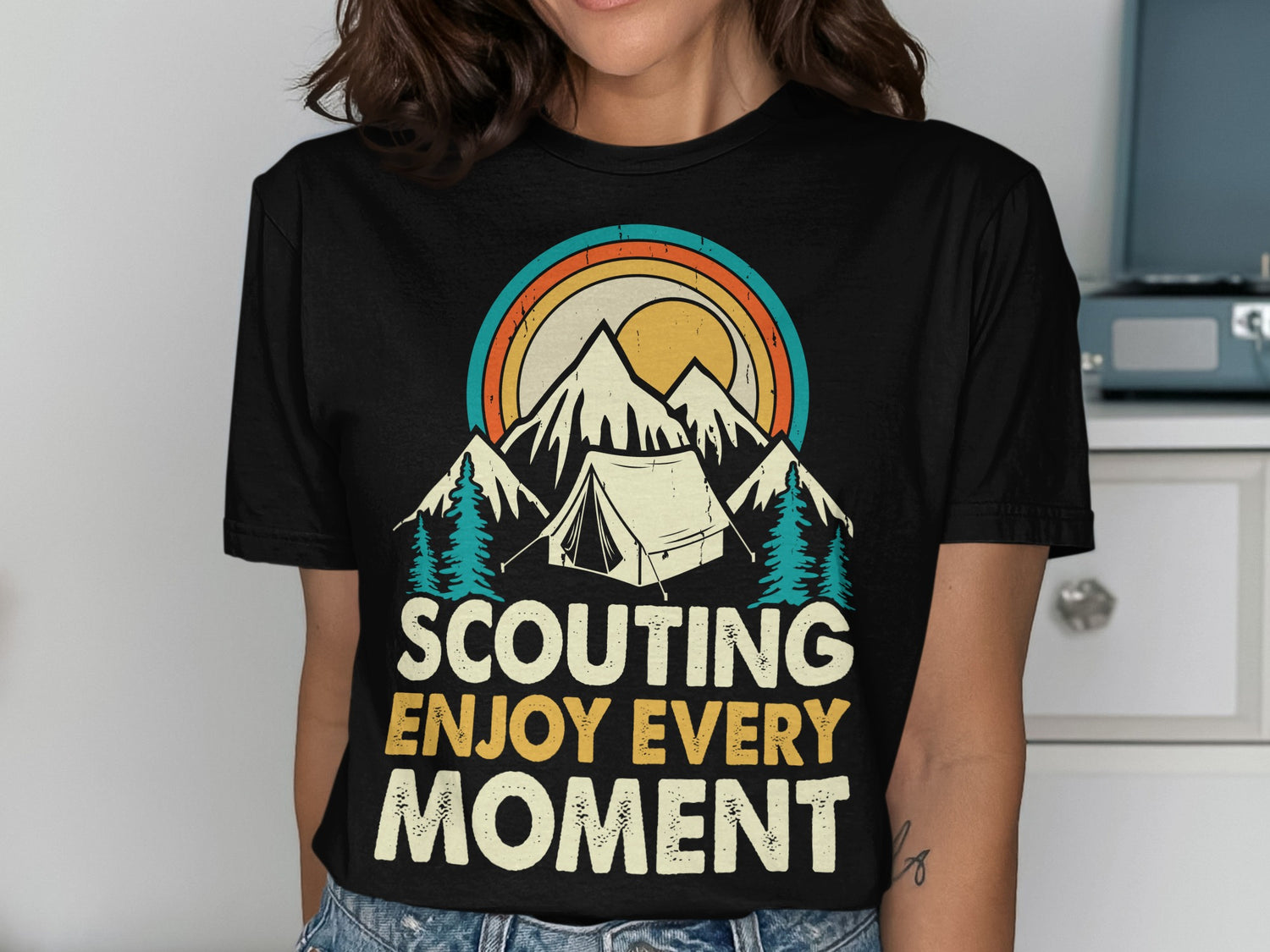 Black t-shirt with "Scouting Enjoy Every Moment" and mountain, tent, sun graphic.