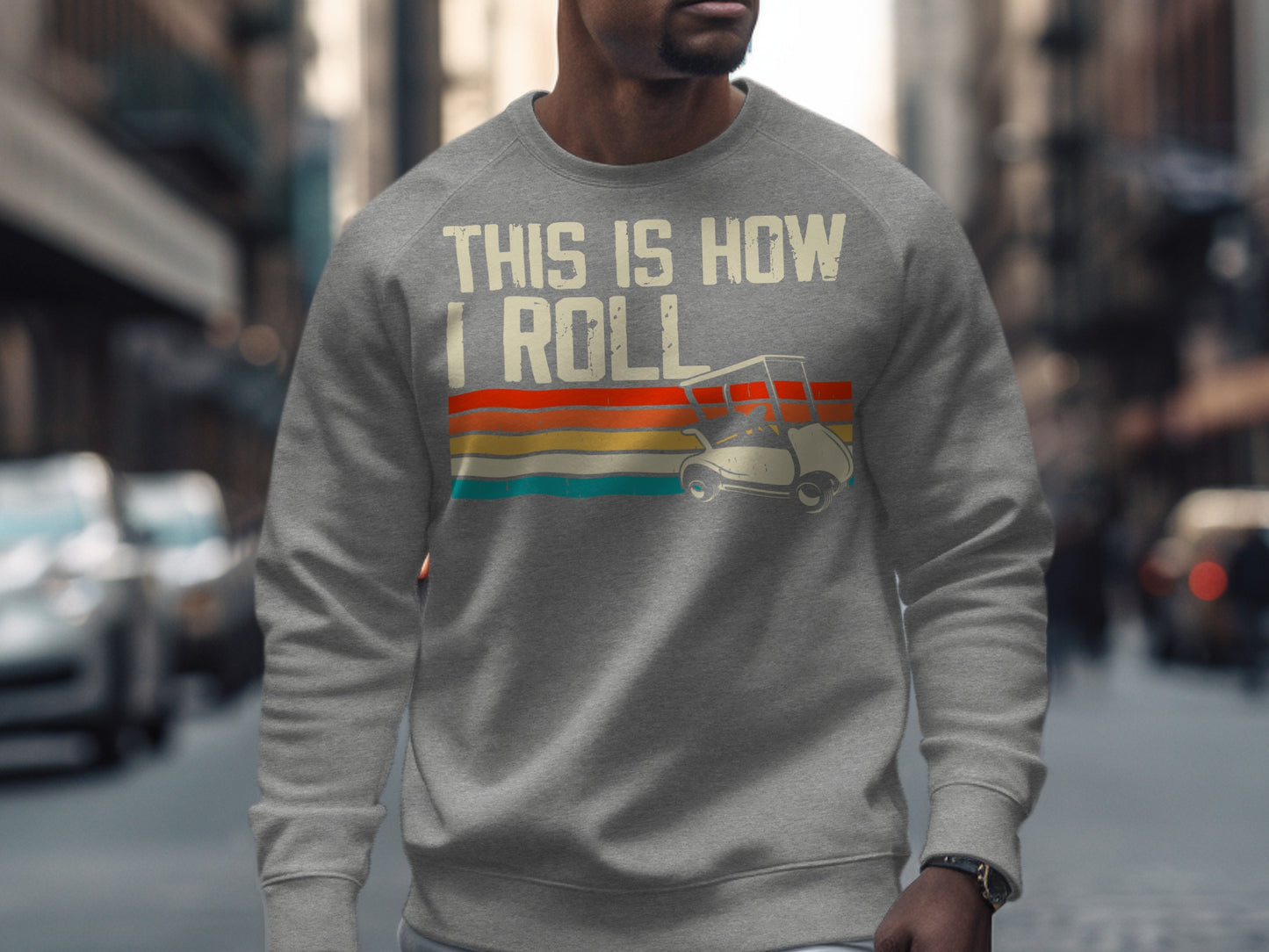 Grey sweatshirt with "This Is How I Roll" and a golf cart graphic.