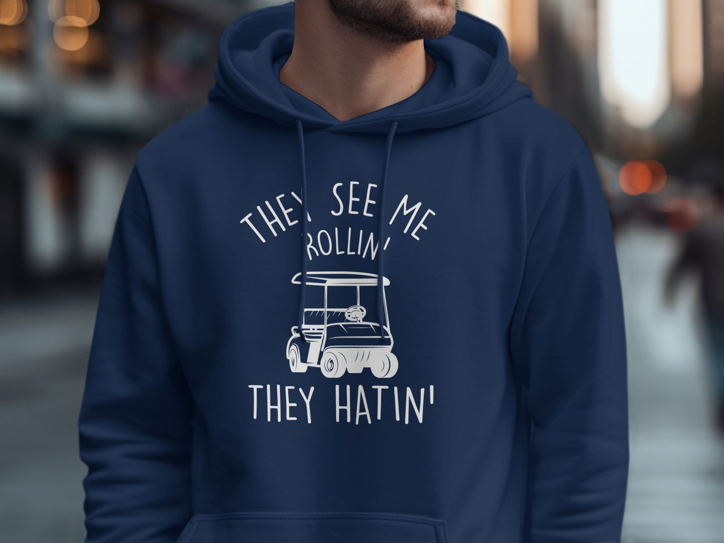 Navy hoodie with a graphic of a golf cart and text "They See Me Rollin' They Hatin'".