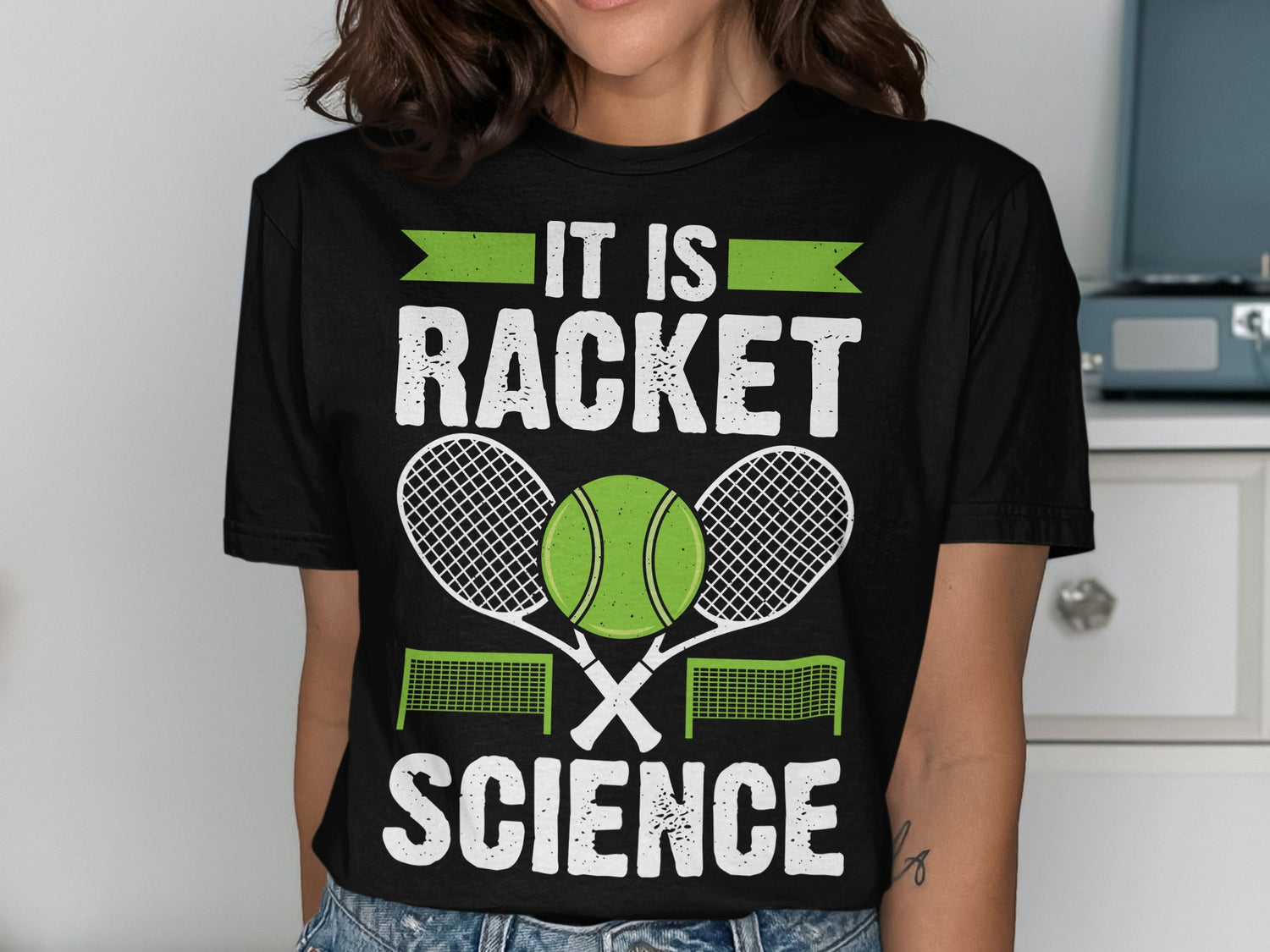 Black t-shirt with "IT IS RACKET SCIENCE" text, tennis ball, and rackets.