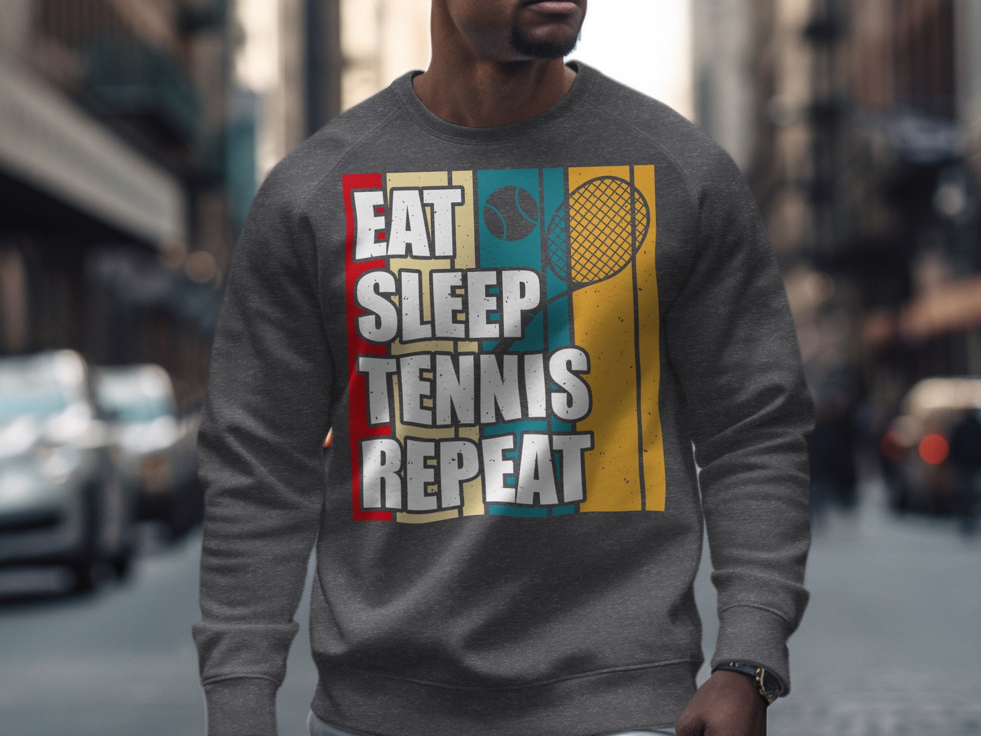 Gray sweatshirt with "Eat Sleep Tennis Repeat" text and a tennis racket graphic.