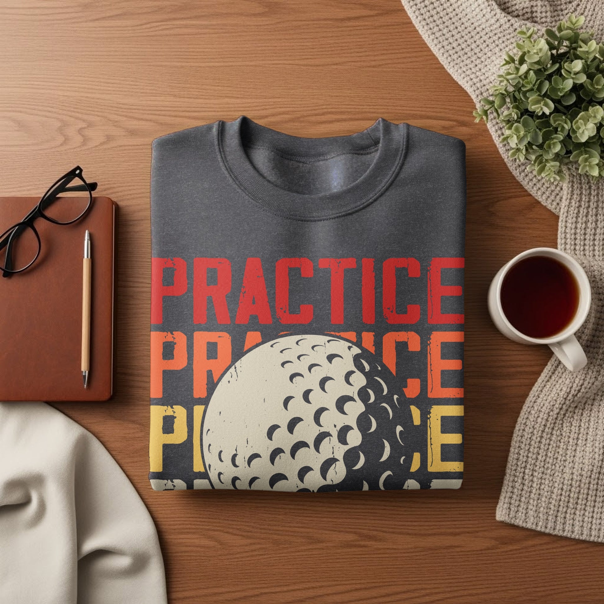Dark gray sweatshirt with "PRACTICE" text and a golf ball graphic.