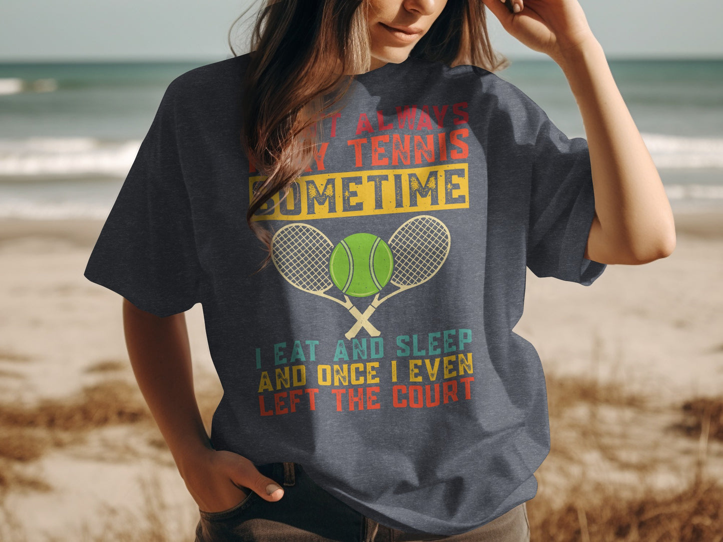 Dark t-shirt with tennis graphic and text: "I Eat Always Tennis Sometime I Eat and Sleep and Once I Even Left the Court"