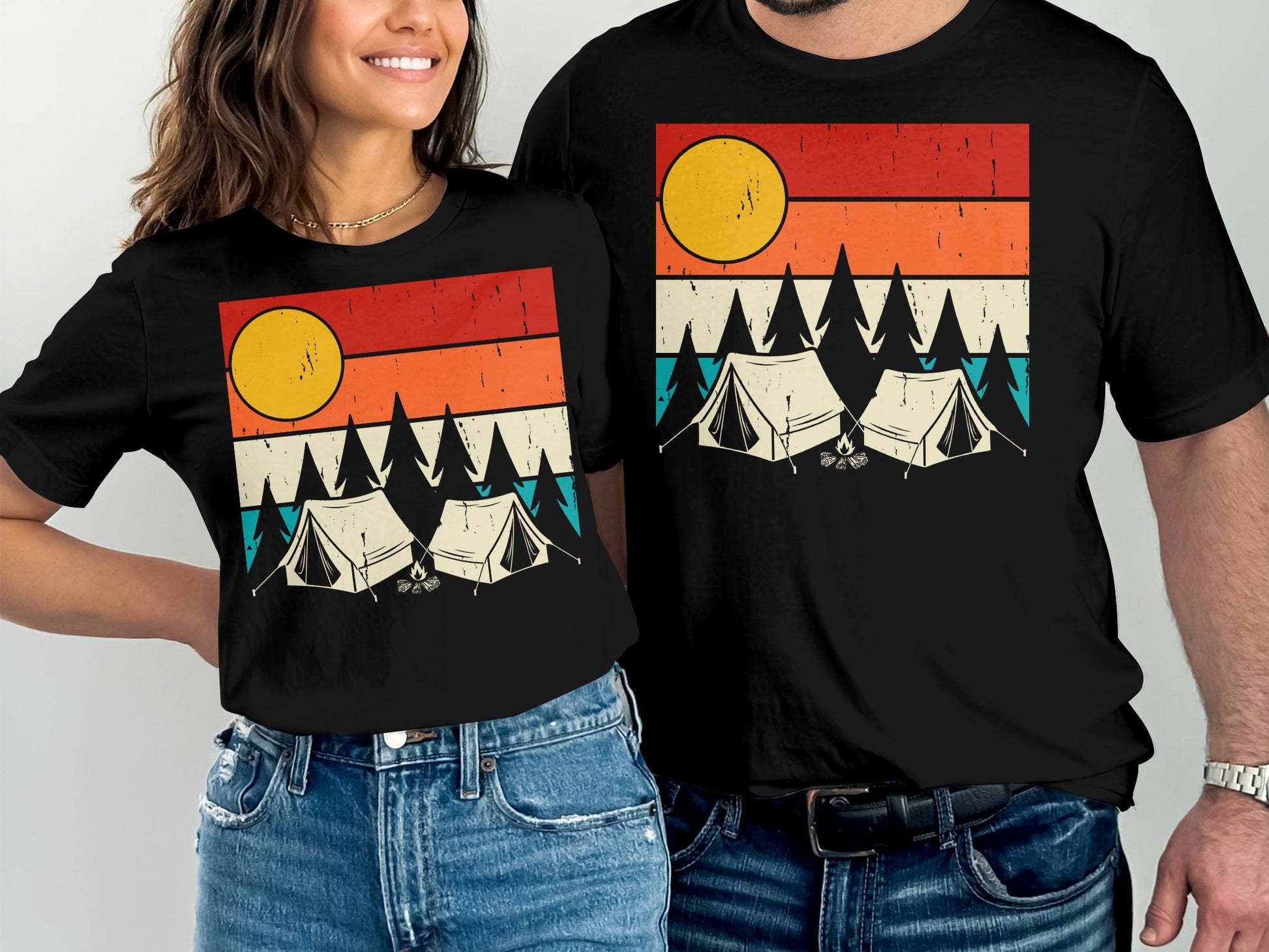 Matching couple's t-shirts with a sunset camping scene.