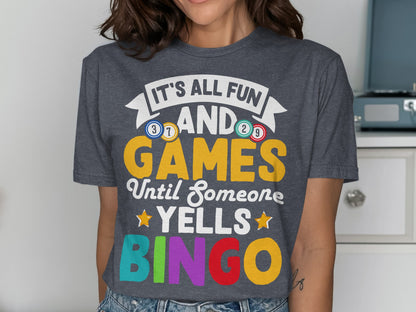 Dark gray t-shirt with "It's All Fun And Games Until Someone Yells Bingo" text.