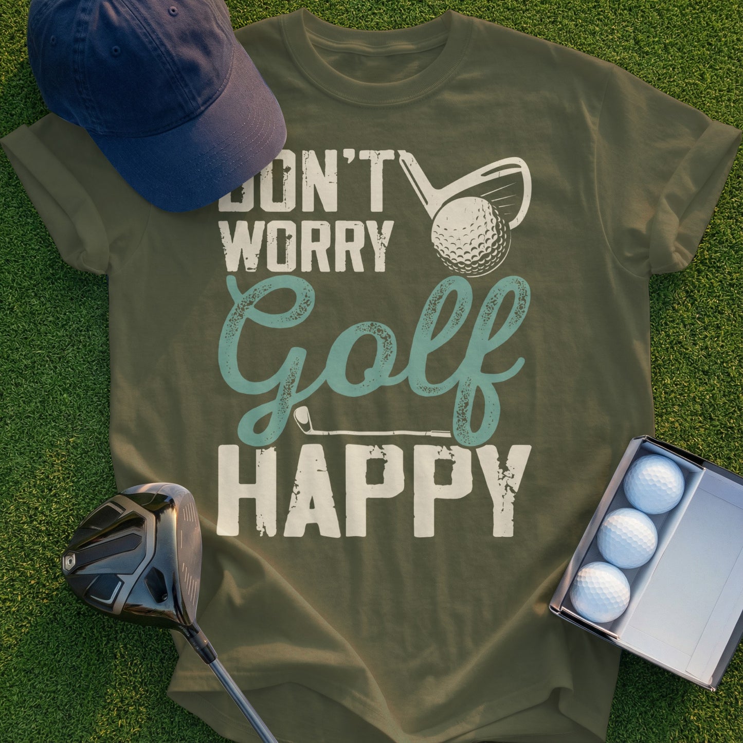 Green t-shirt with "Don't Worry Golf Happy" text, golf club, and balls.