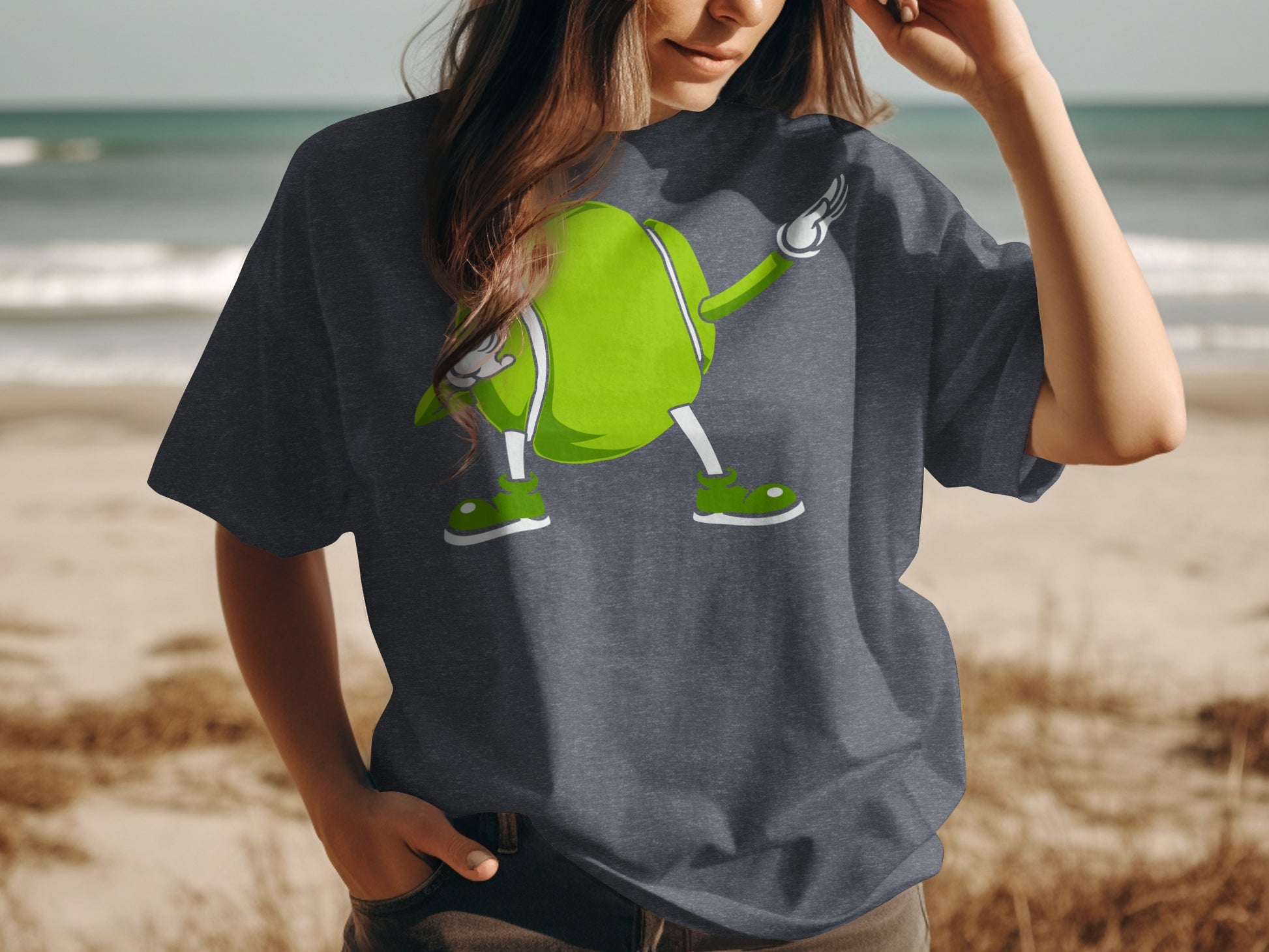 T-shirt featuring a cartoon tennis ball character doing the dab dance.