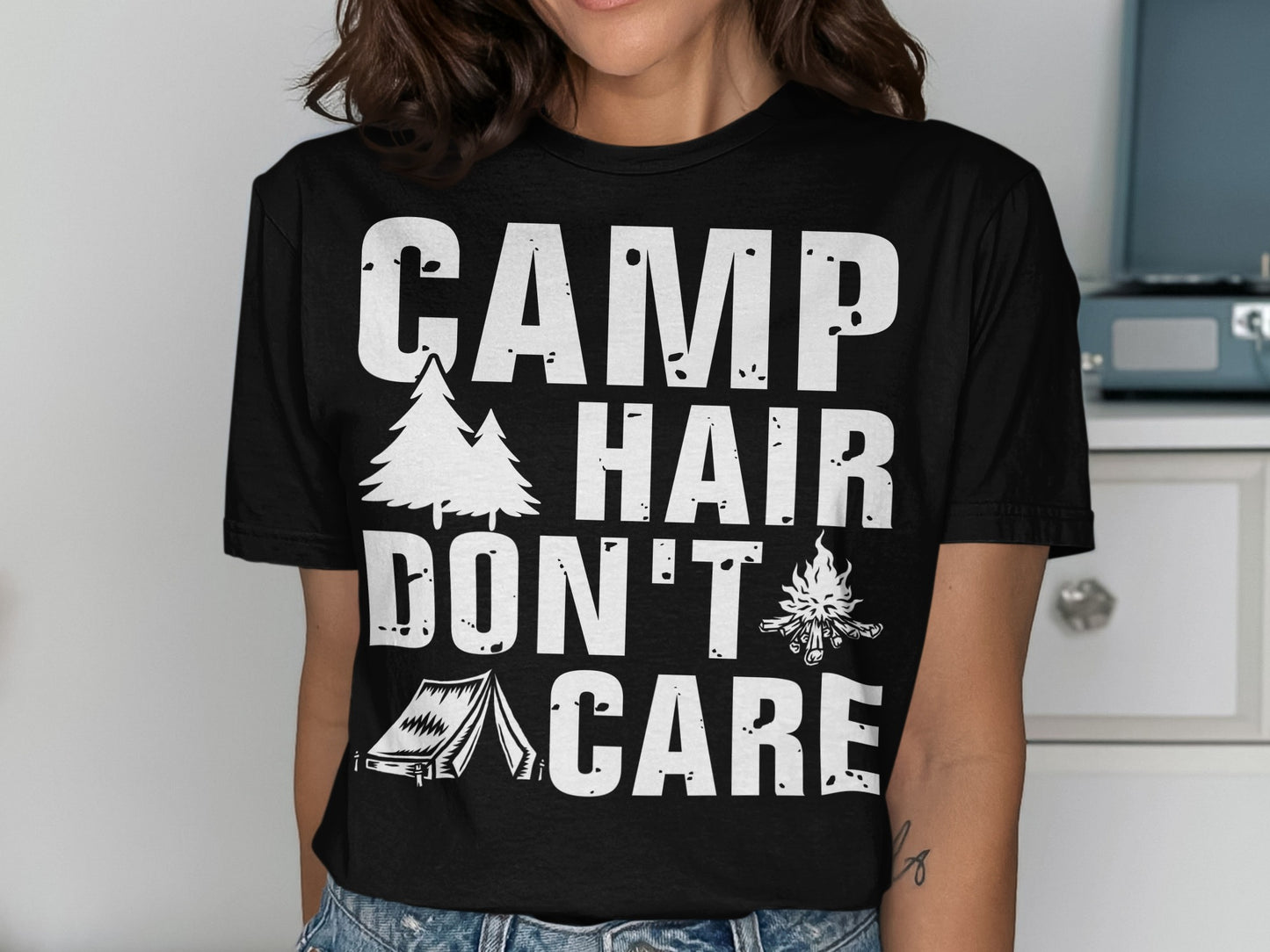 Black t-shirt with "CAMP HAIR DON'T CARE" text and camping graphics.