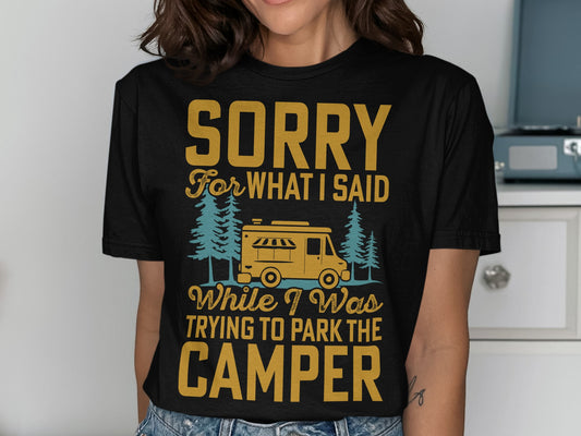 Black t-shirt with yellow text reading "Sorry for what I said while I was trying to park the camper" and a camper illustration.