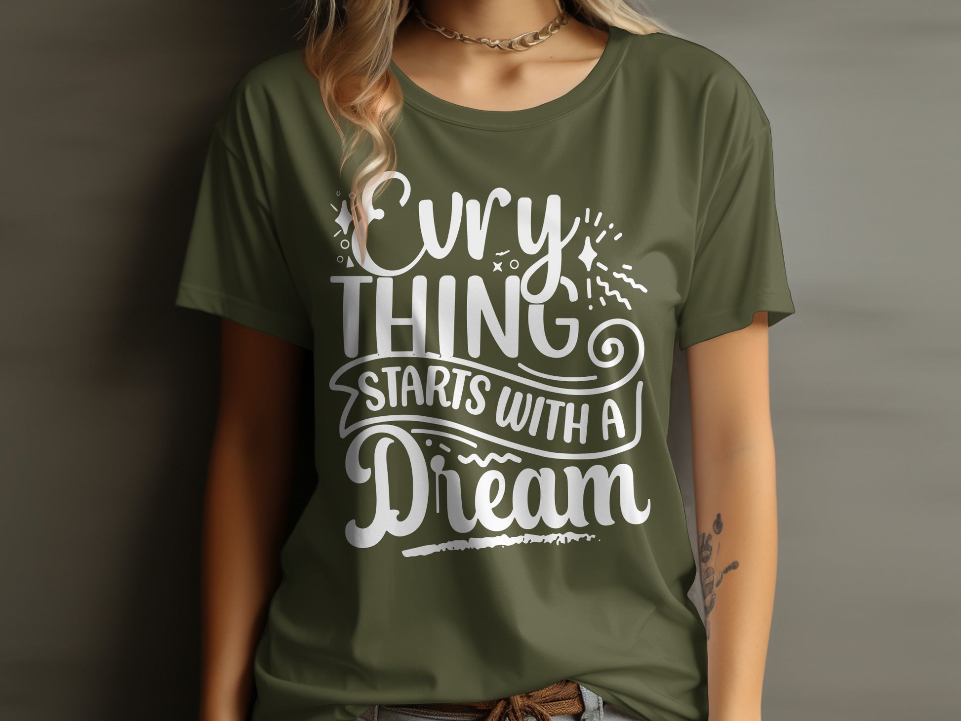 Olive green t-shirt with "EVERYTHING STARTS WITH A DREAM" text.