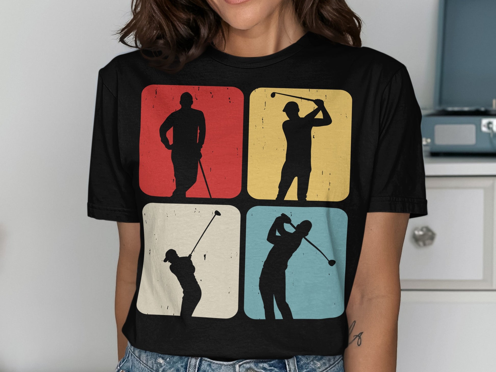 Four framed silhouettes of golfers in different poses on a t-shirt.