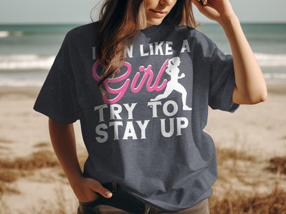 T-shirt with pink text and runner graphic saying "I CAN LIKE A GIRL TRY TO STAY UP".