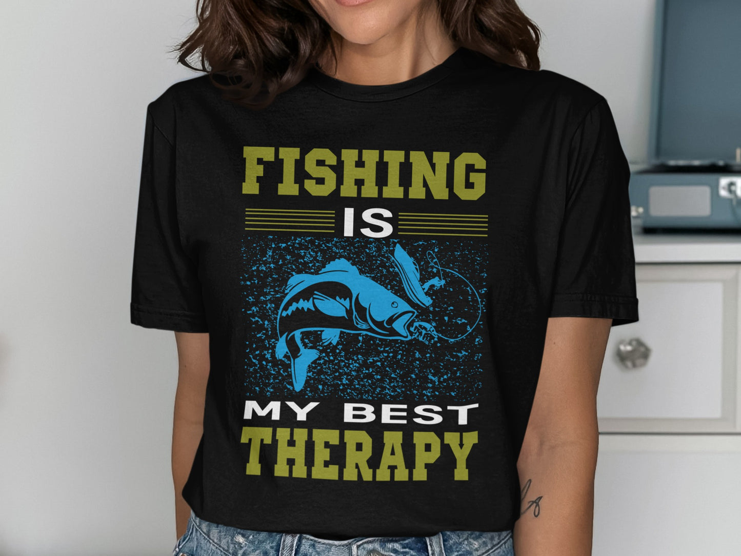 Black t-shirt with "FISHING IS MY BEST THERAPY" and a blue fish design.