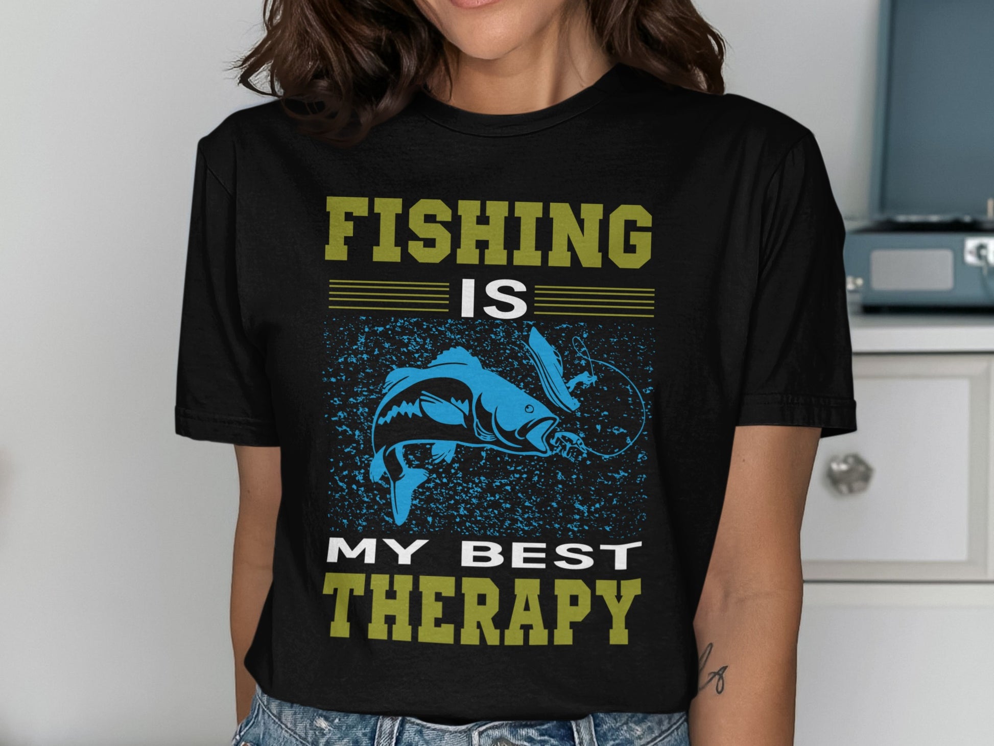 Black t-shirt with "FISHING IS MY BEST THERAPY" and a blue fish design.