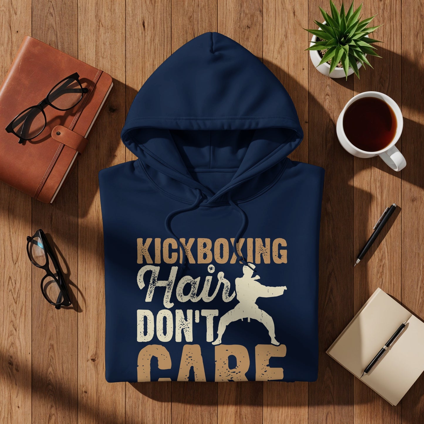 Navy hoodie with "Kickboxing Hair Don't Care" text and graphic.