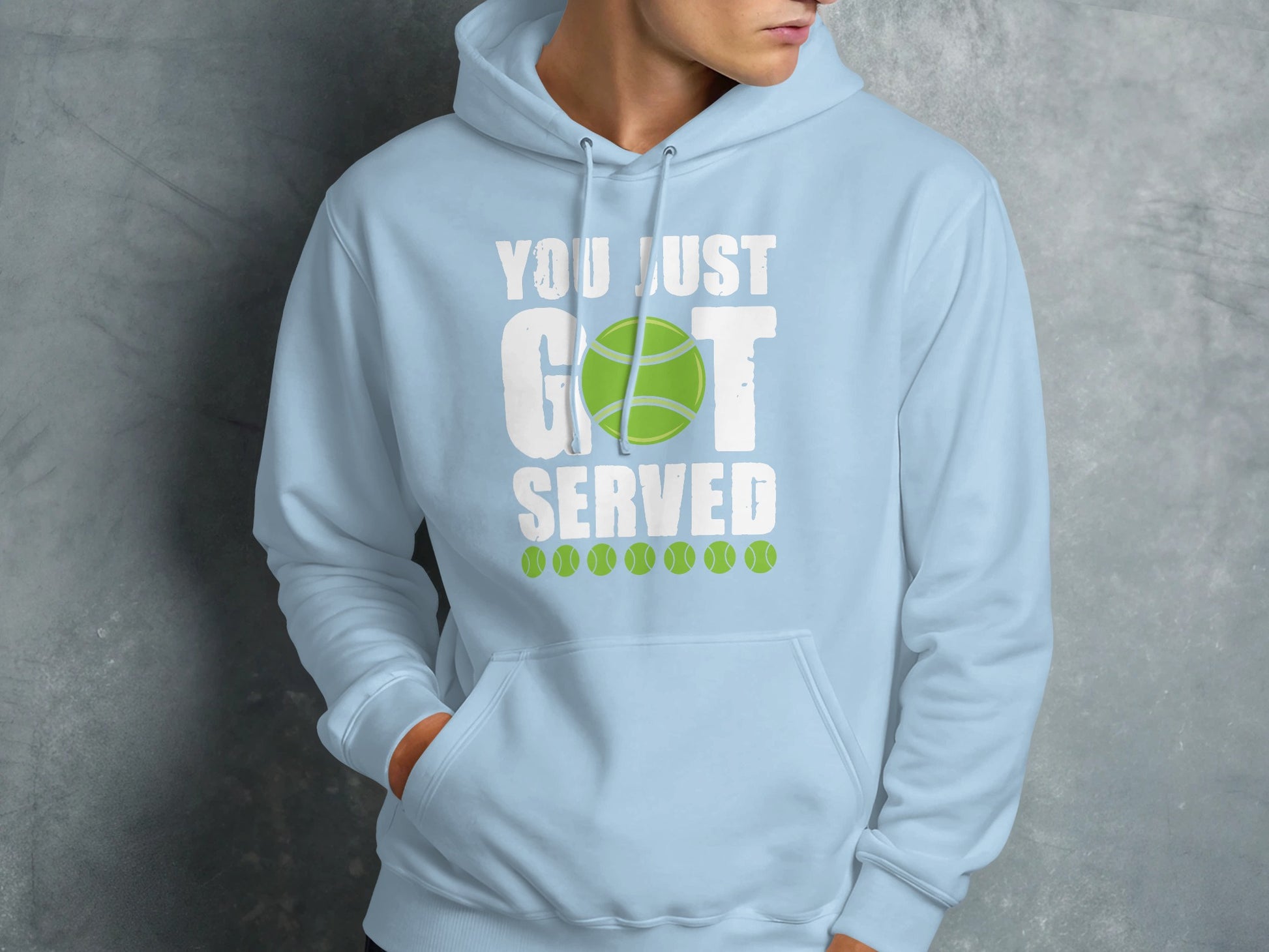 Light blue hoodie with "YOU JUST GOT SERVED" text and tennis balls.