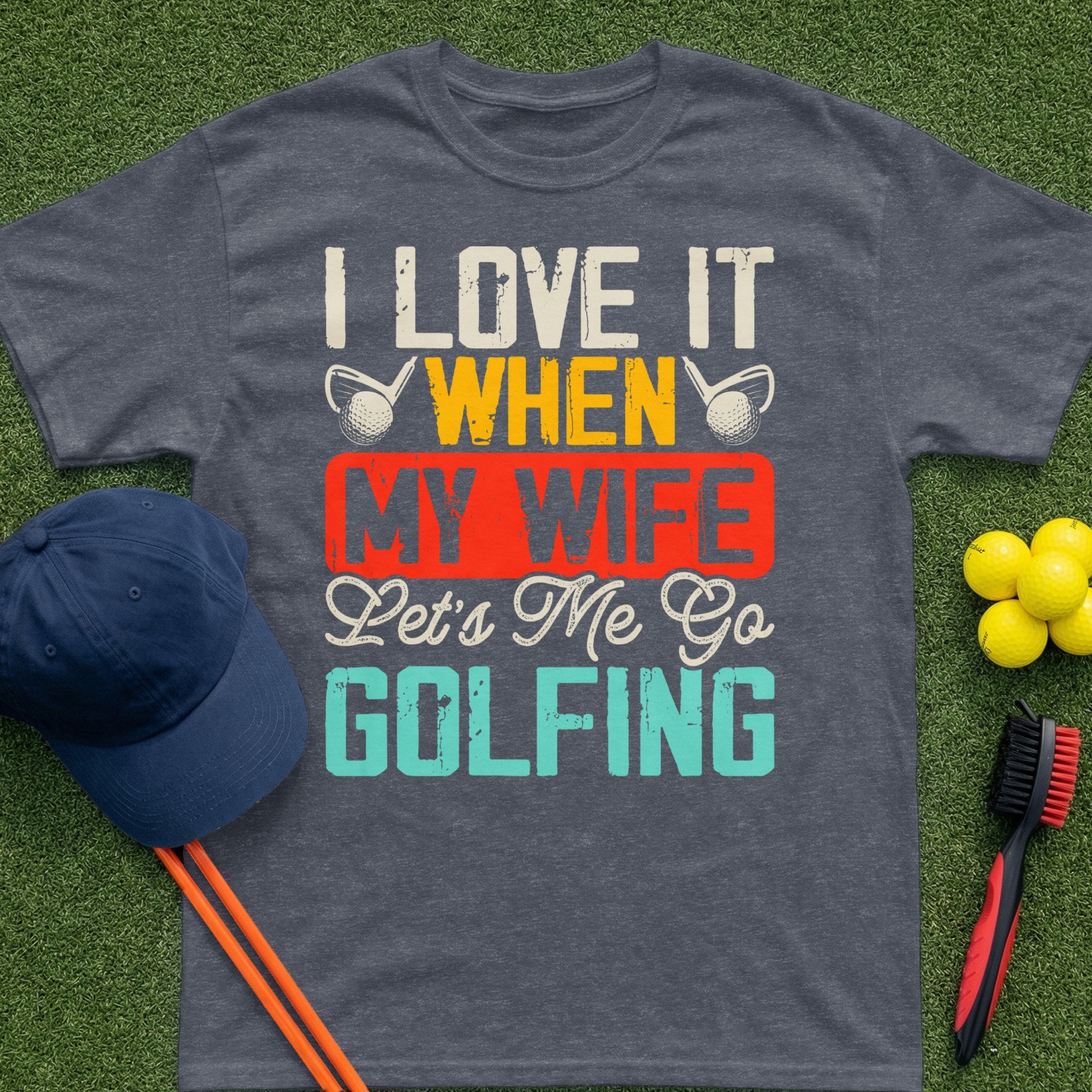 Dark grey t-shirt with text "I love it when my wife lets me go golfing."