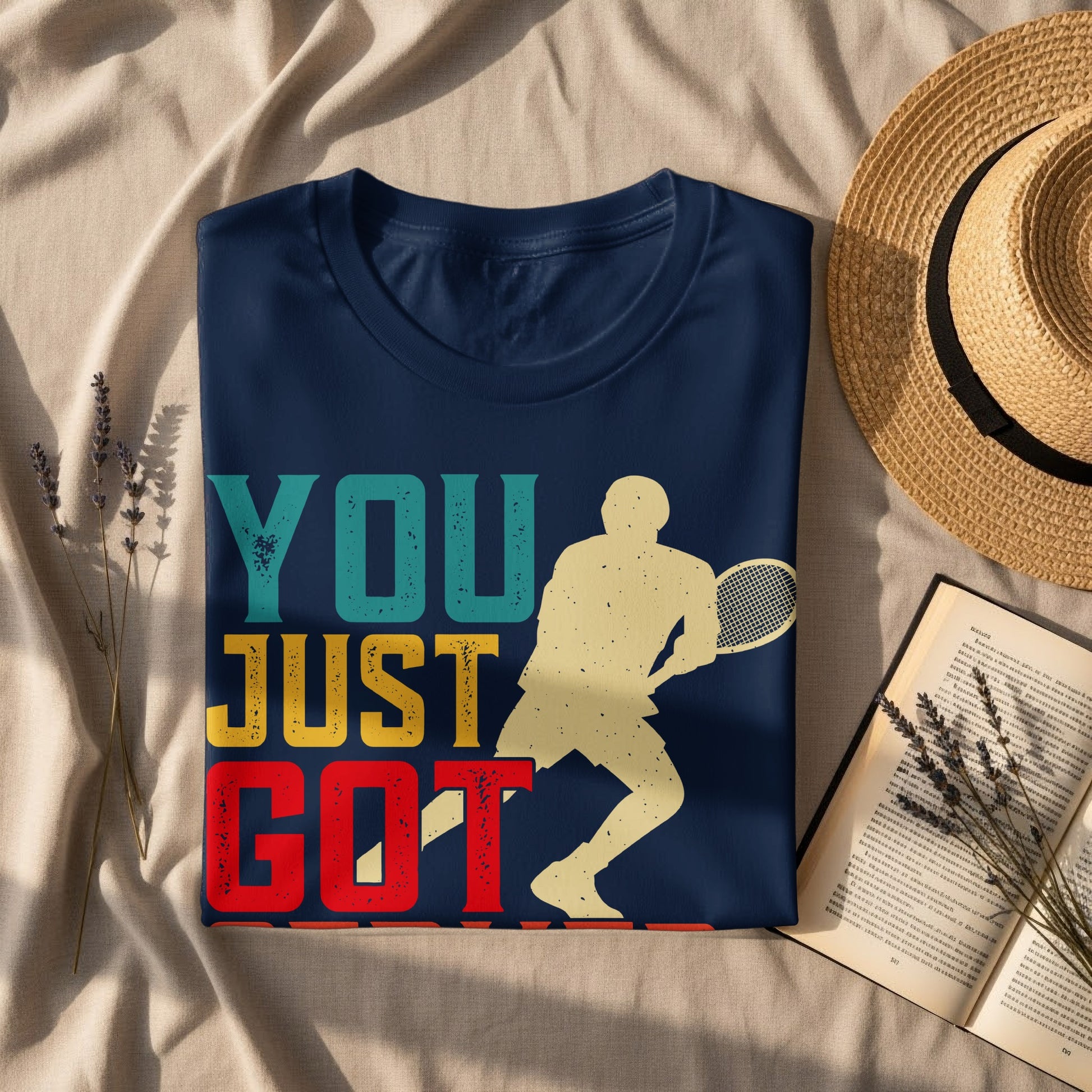 Dark blue t-shirt with distressed "YOU JUST GOT" text and tennis player graphic.