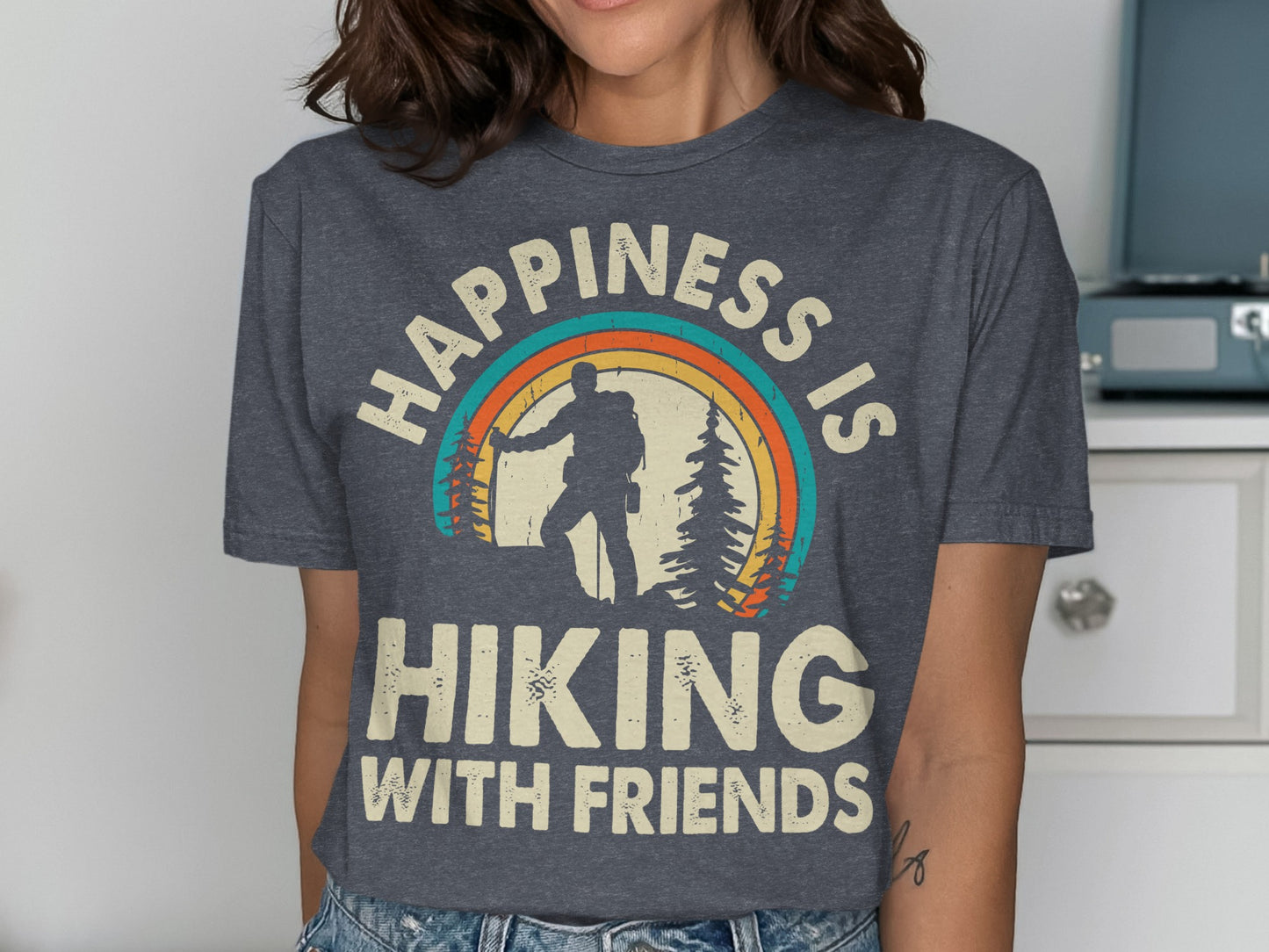 Dark gray t-shirt with "Happiness is Hiking with Friends" and a rainbow hiker graphic.