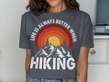 T-shirt with mountains, sun, and text "Life is always better when HIKING".