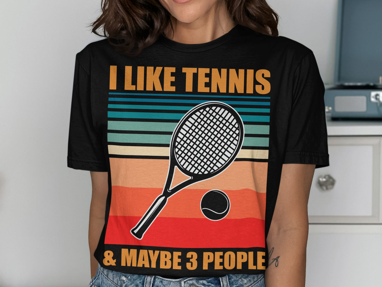 Black t-shirt with "I LIKE TENNIS & MAYBE 3 PEOPLE" and tennis racket graphic.