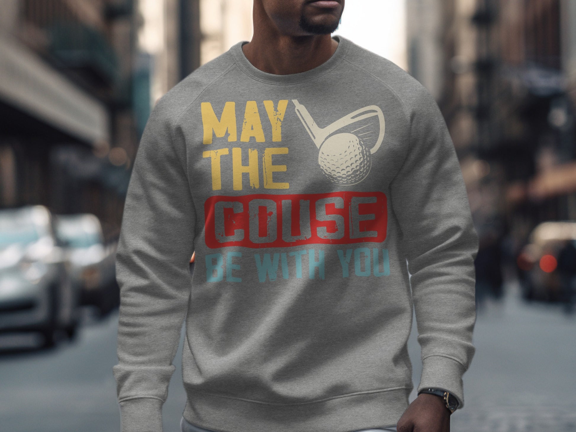 Grey sweatshirt with "May the course be with you" golf graphic.
