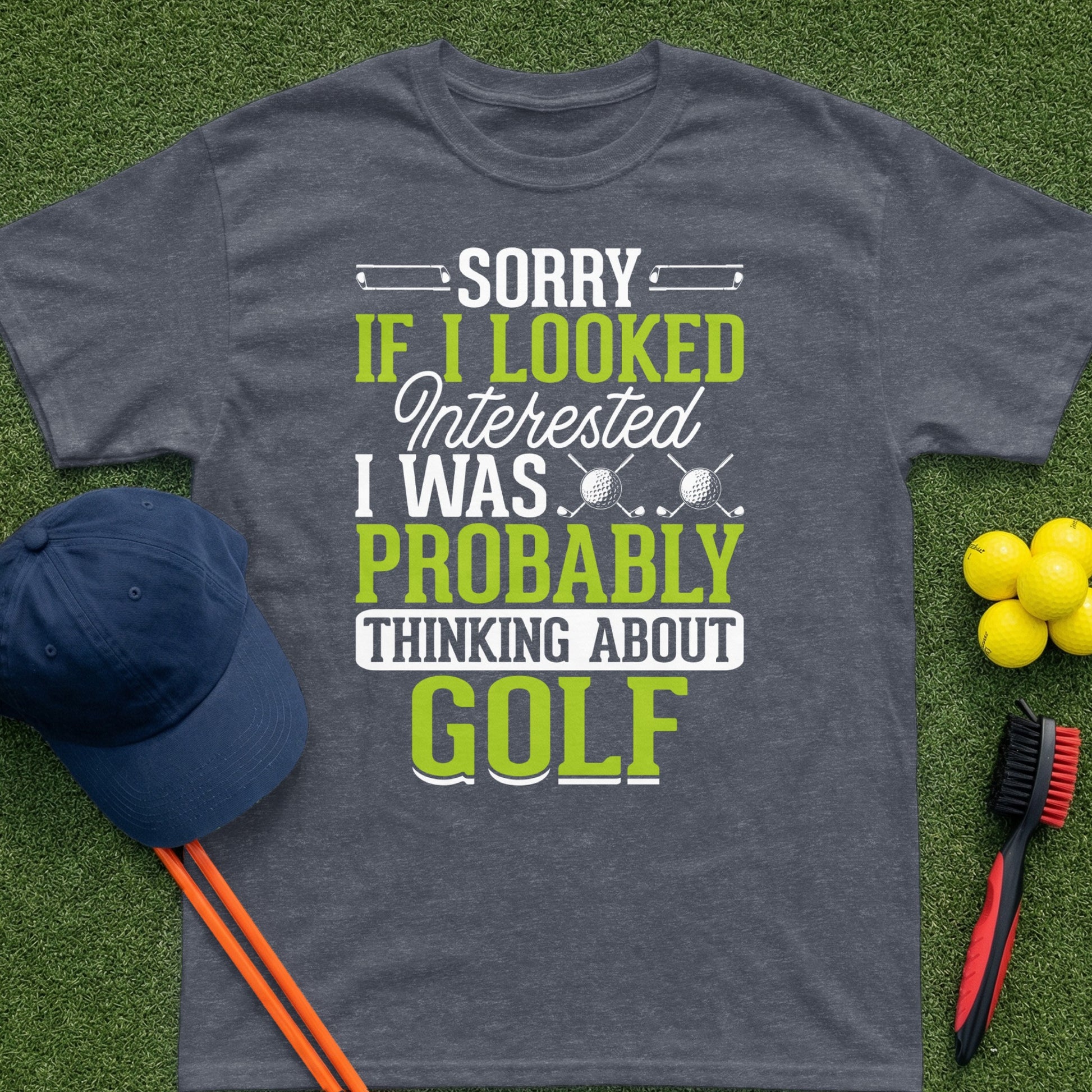 Charcoal t-shirt with "Sorry if I looked interested I was probably thinking about GOLF" text.