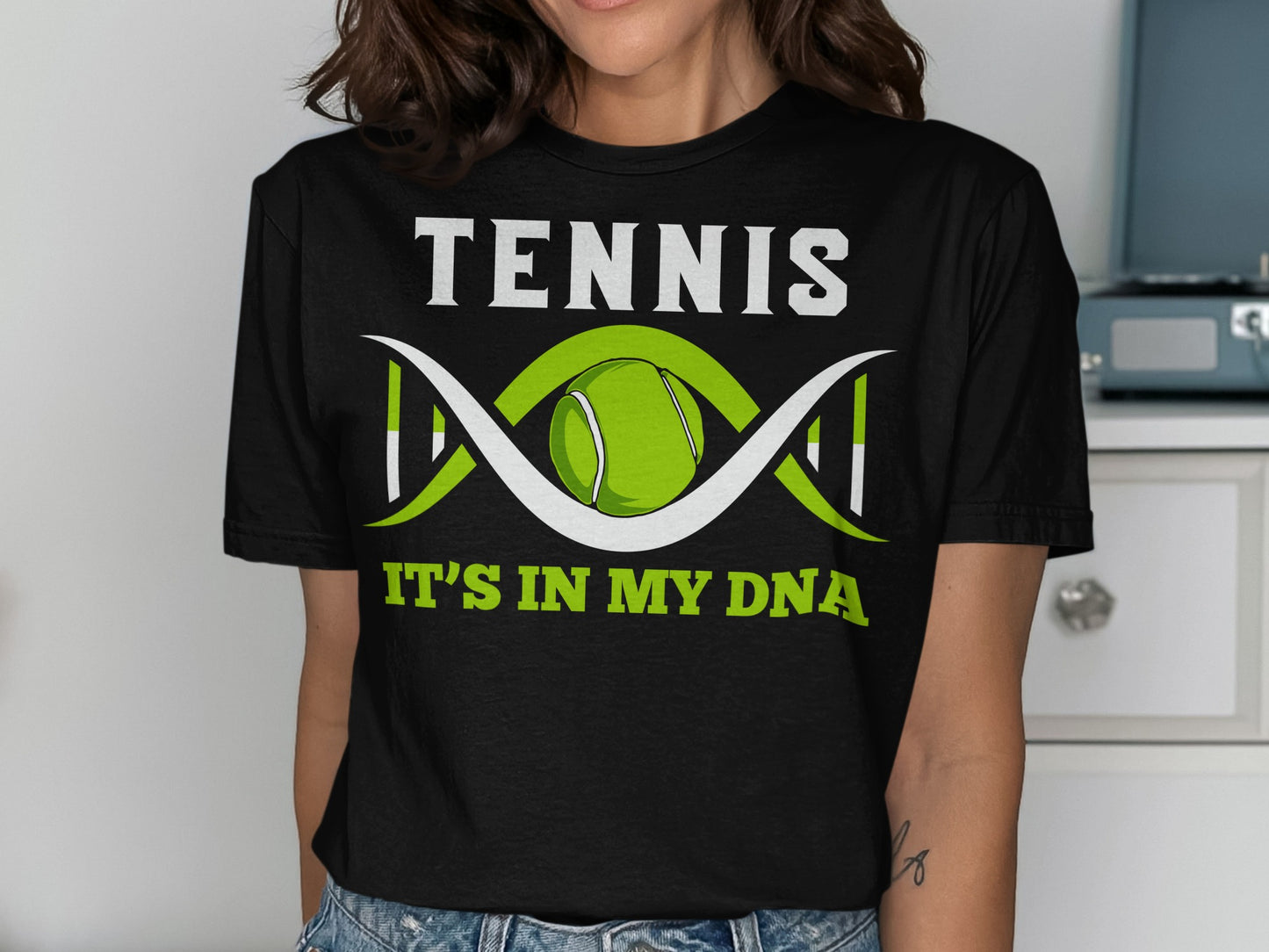 Black t-shirt with "TENNIS IT'S IN MY DNA" and tennis ball DNA graphic.