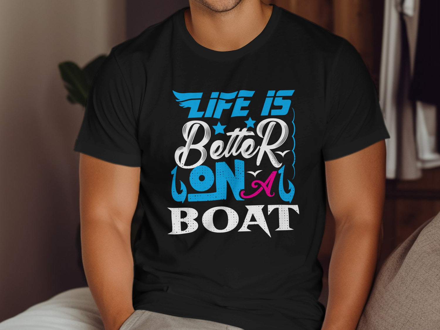 Black t-shirt with "Life is Better on a Boat" text and fishing hook graphics.