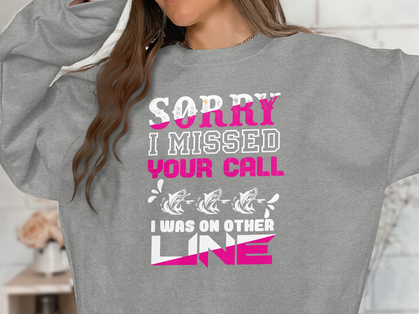 Gray sweatshirt with "Sorry I Missed Your Call, I Was On Other Line" text.