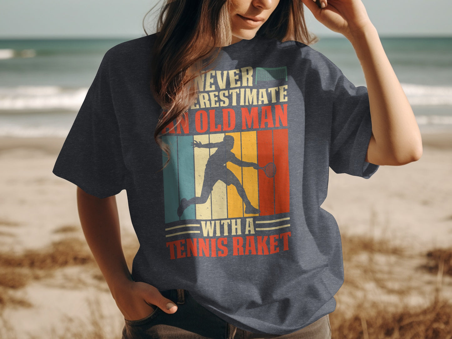 T-shirt with a graphic of a tennis player and text "Never underestimate an old man with a tennis racket".