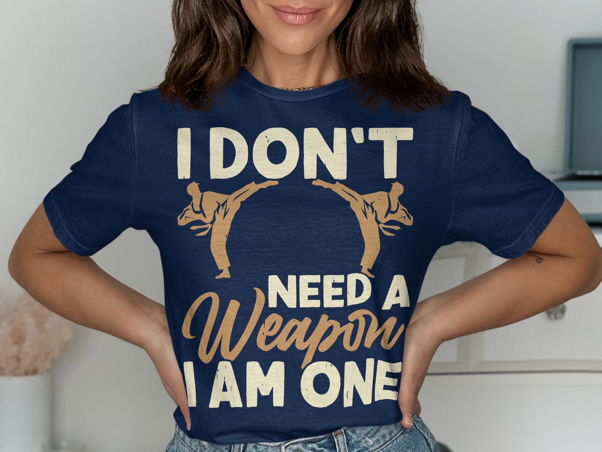 Navy t-shirt with martial artists and text "I DON'T NEED A WEAPON I AM ONE".