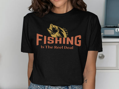Black t-shirt with orange "Fishing Is The Reel Deal" text and fish graphic.