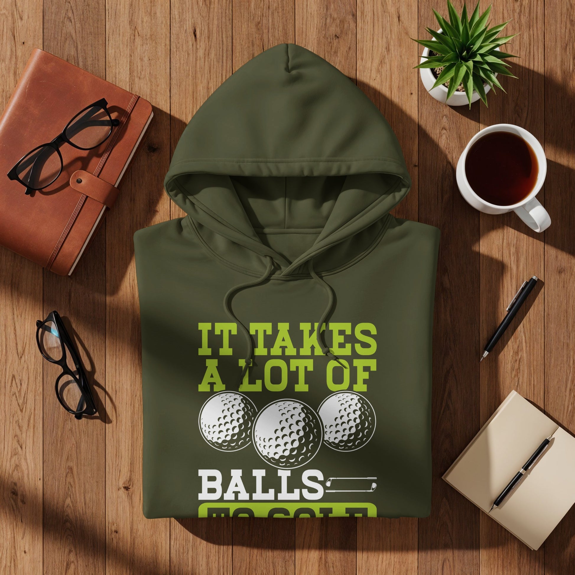 Olive green hoodie with "IT TAKES A LOT OF BALLS" and golf balls graphic.