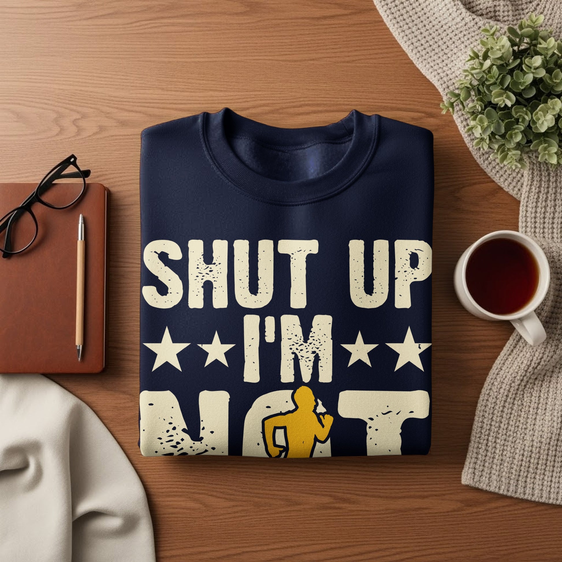 Navy sweatshirt with white text "SHUT UP I'M NOT" and a running silhouette.