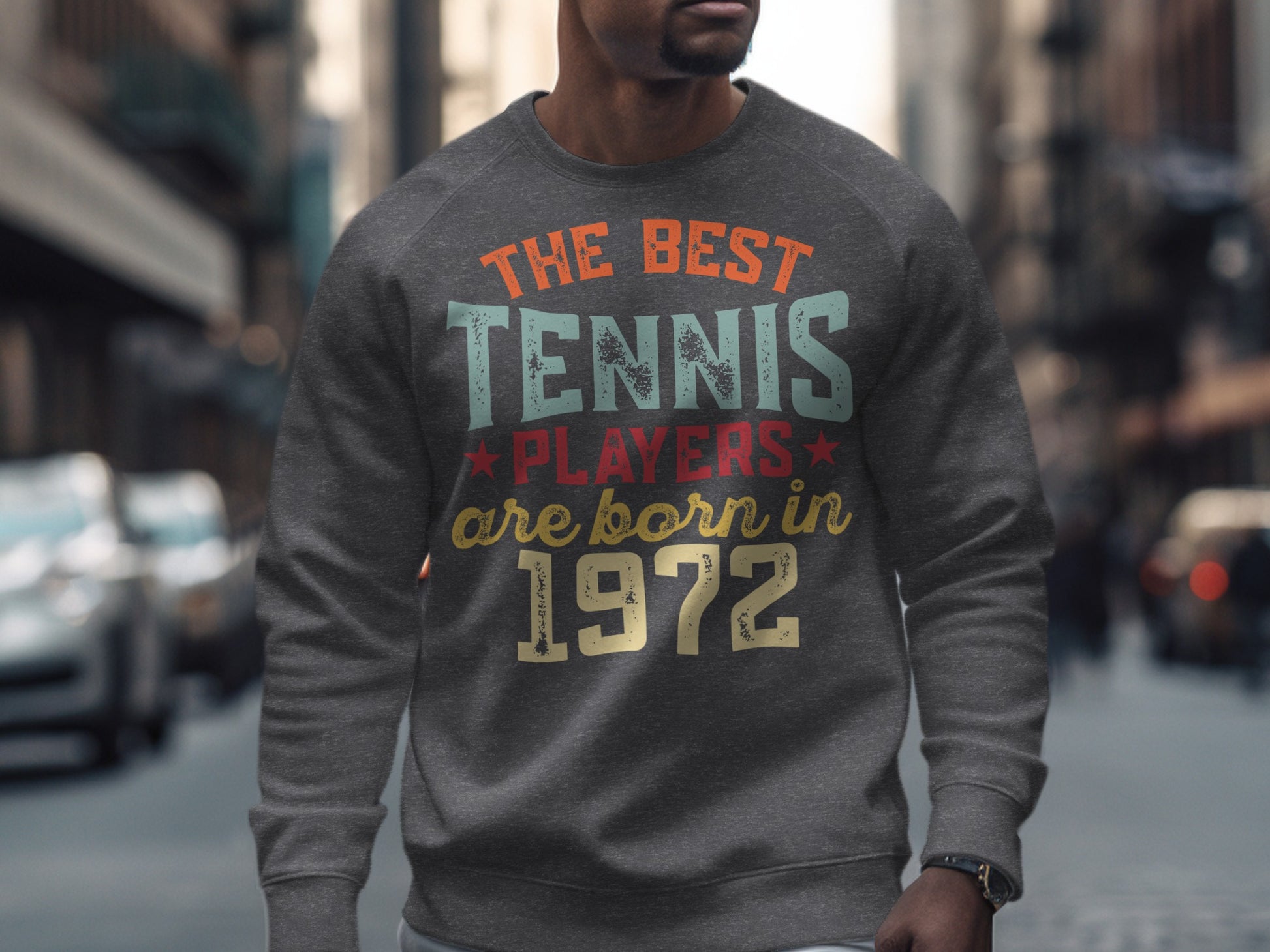 Gray sweatshirt with "The Best Tennis Players Are Born In 1972" text.