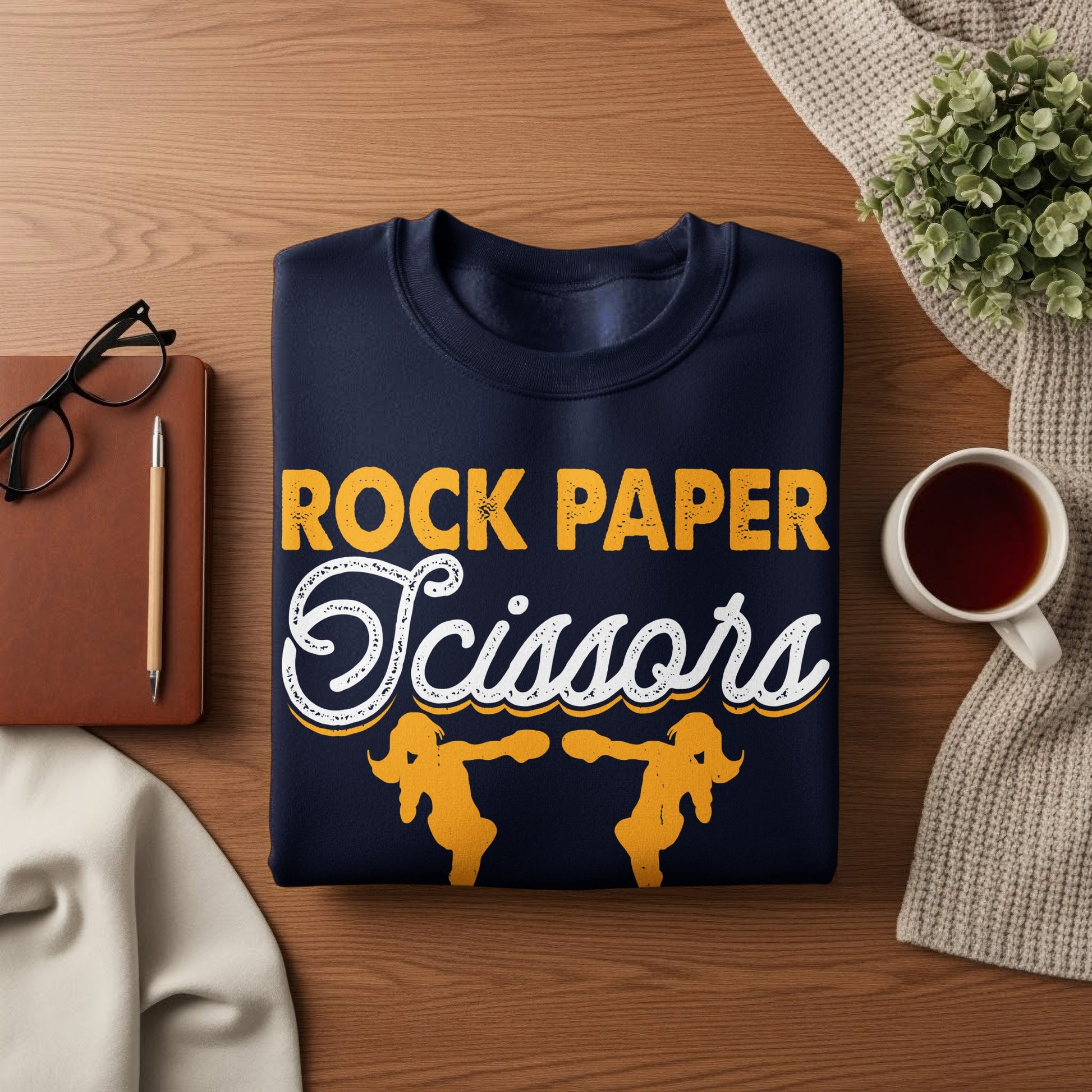 Navy sweatshirt with "Rock Paper Scissors" text and graphic design.